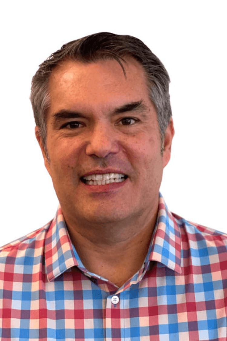 A man in a red and blue check shirt.